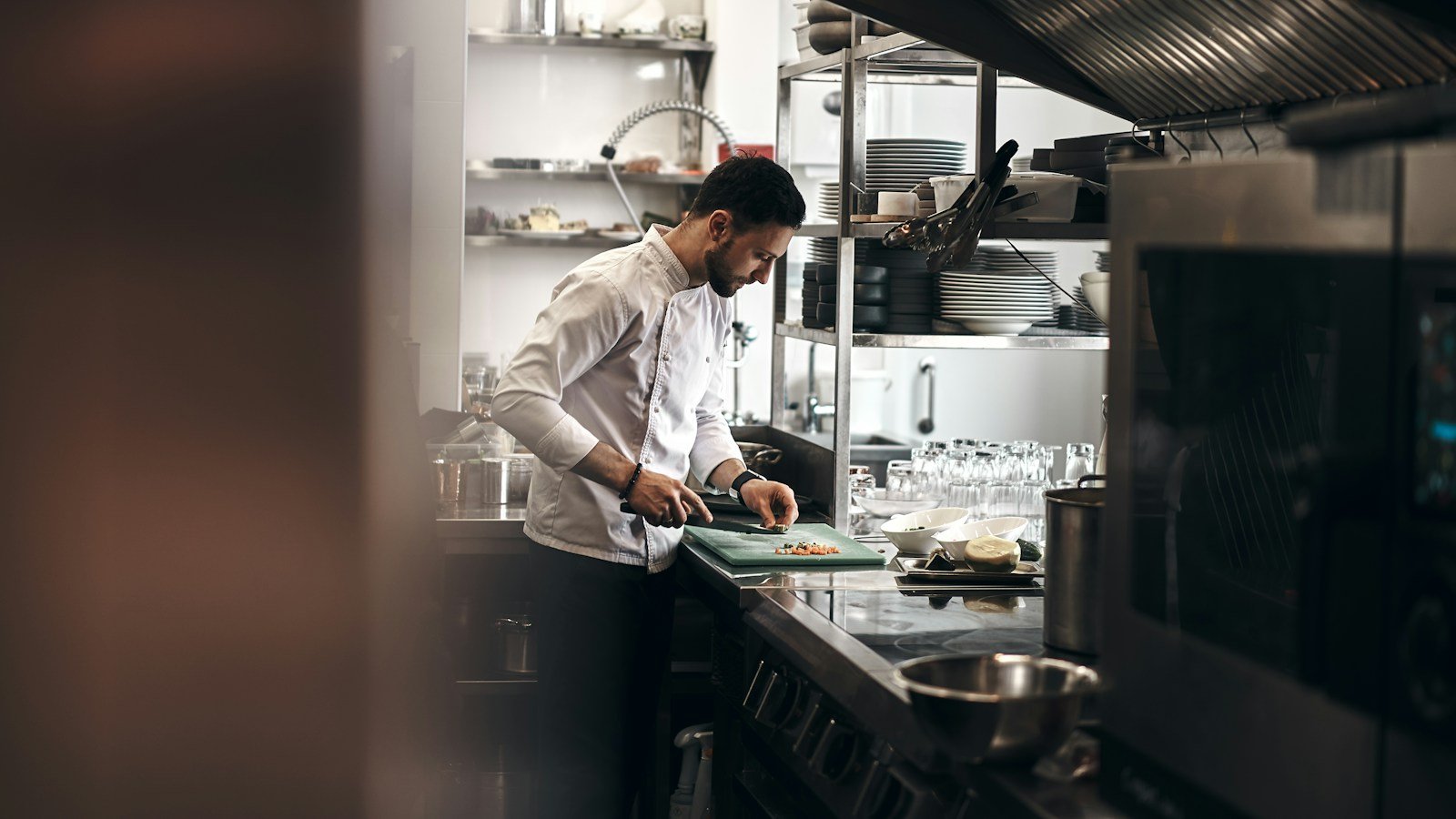 Chef preparing seasonal vegetables in the kitchen
